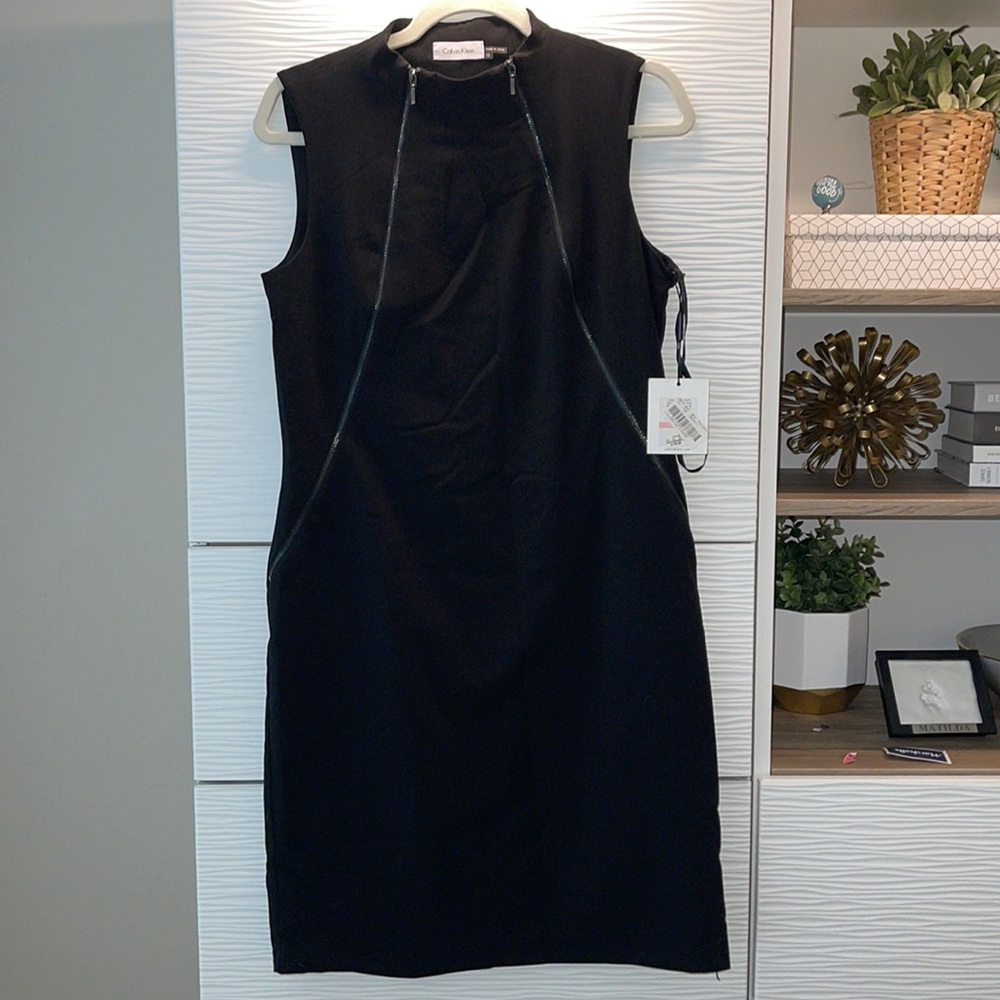 New with tags - great dress for work or going out! Black Calvin Klein w/ zippers